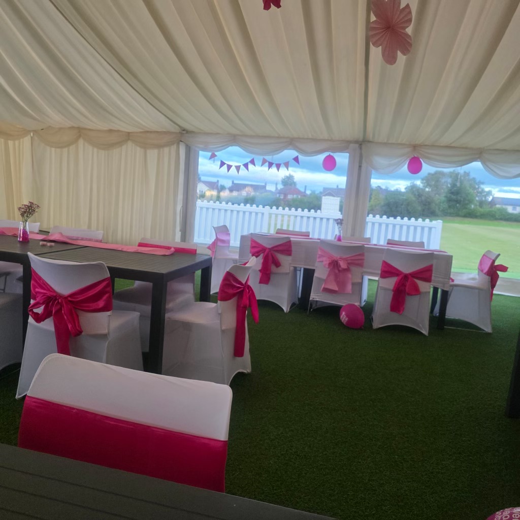 Pink Ribbons On Tables In Outdoor Marquee