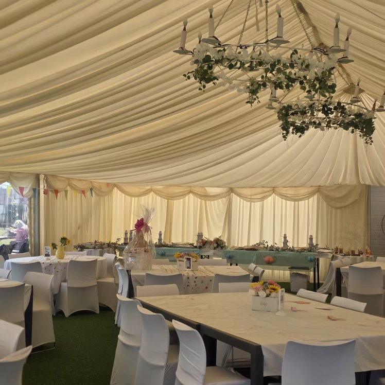 White Tables In Outdoor Marquee